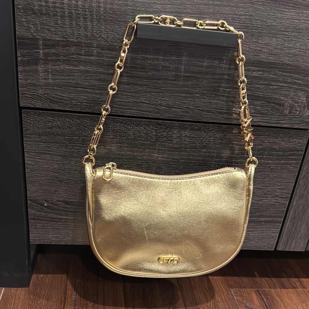 MICHAEL Michael Kors Pale Gold Metallic SM Pouchette Leather Bag.Few small marks